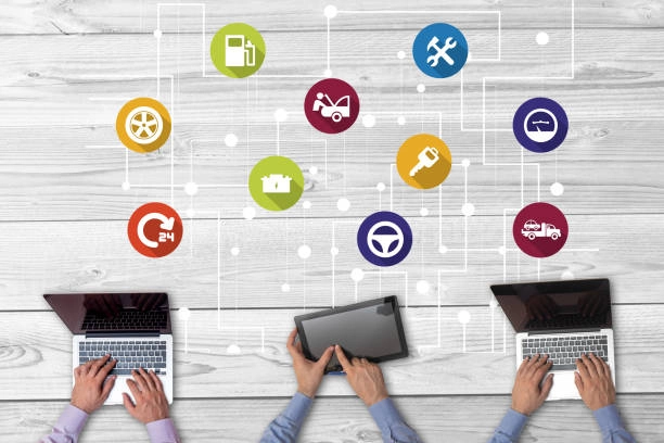 Hands using laptops and tablet with floating automotive service icons. -social media content creation agency